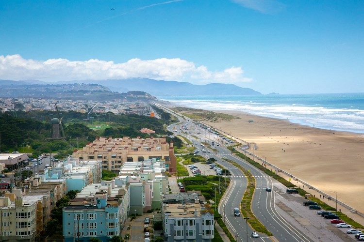 an aerial view of a city and the beach