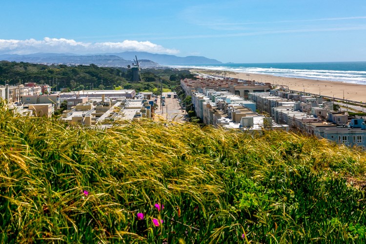 an aerial view of the beach and the city