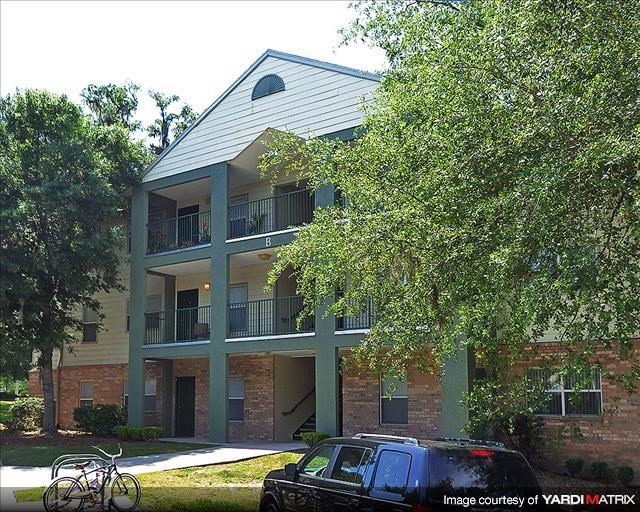 a car parked in front of an apartment building
