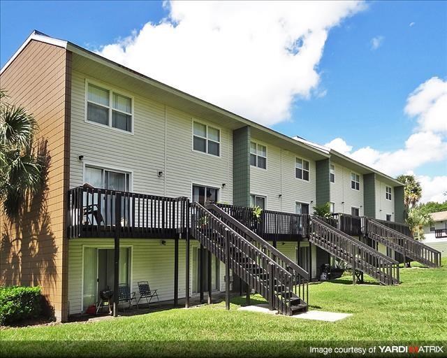 an apartment building with two sets of stairs