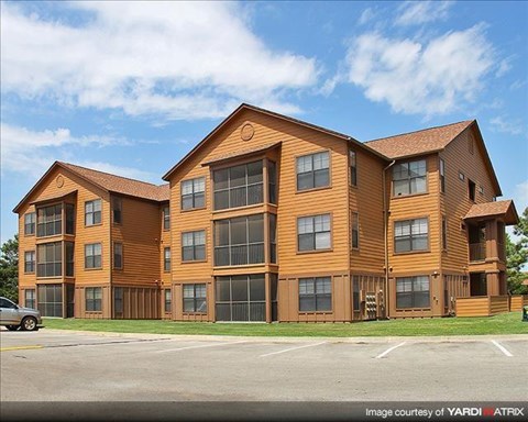 a large apartment building on the side of a street