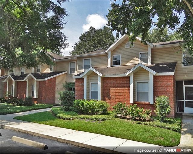 a row of houses on the side of a street