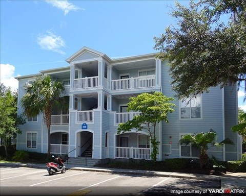 a blue building with a motorcycle parked in front of it