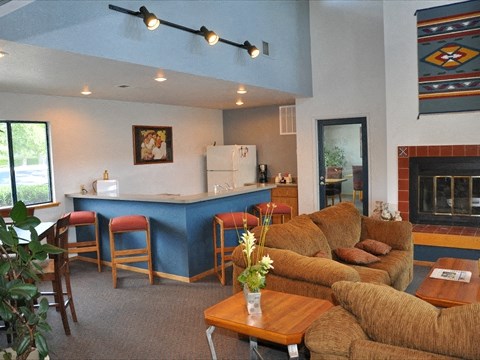 Seating area by fireplace and kitchen 