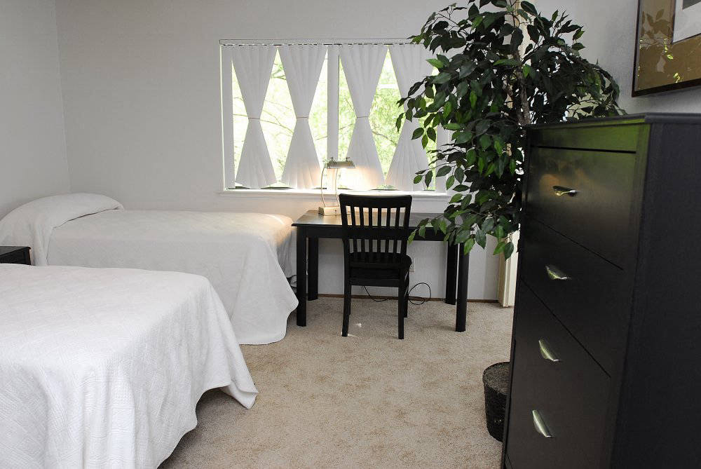 bedroom with desk  l Pepperwood Apartments in Davis CA