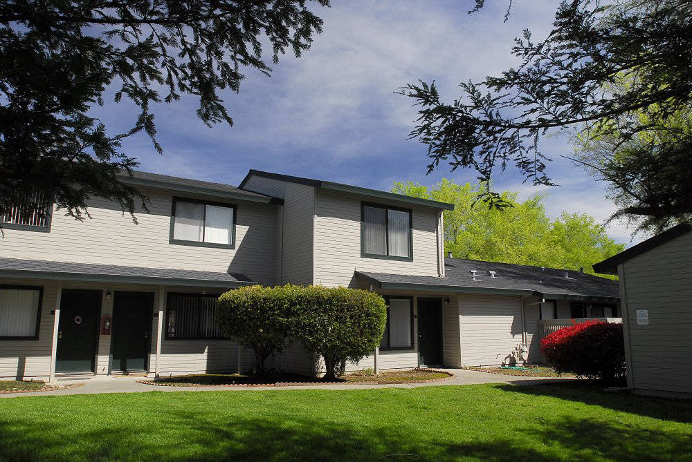 Exterior building near landscape grass  l Pepperwood Apartments in Davis CA
