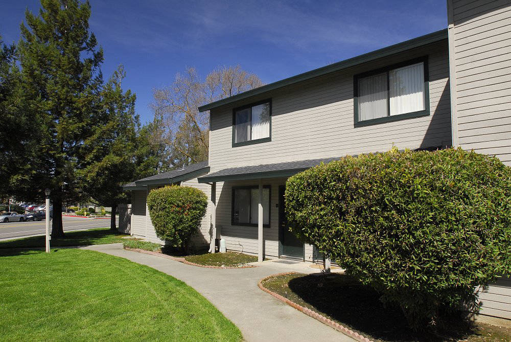 Exterior building near landscape grass  l Pepperwood Apartments in Davis CA