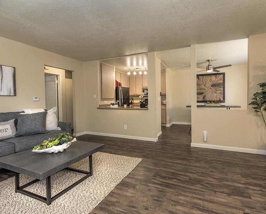 Living room with kitchen view l Foxborough Apartments