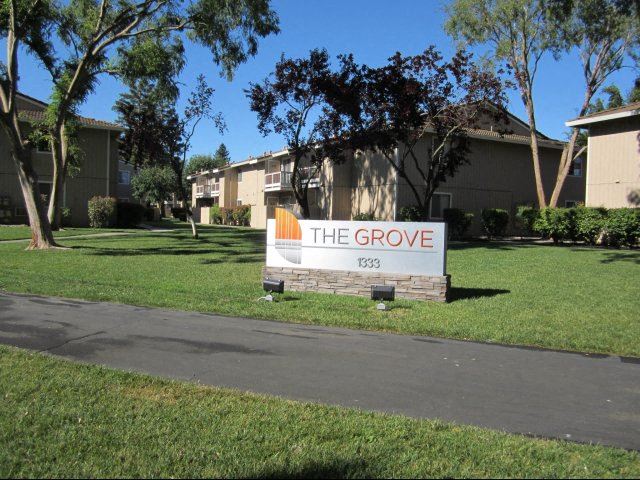 Entry Sign l The Grove Apartments in Davis CA - Photo Gallery 1