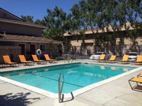 Pool and lounge chairs l The Grove Apartments in Davis CA