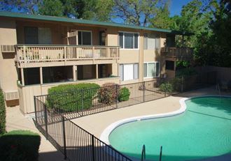 Pet-Friendly Apartments in Walnut Creek, CA - Creekside Terrace - Gated Sparkling Swimming Pool and View of Apartment Complex