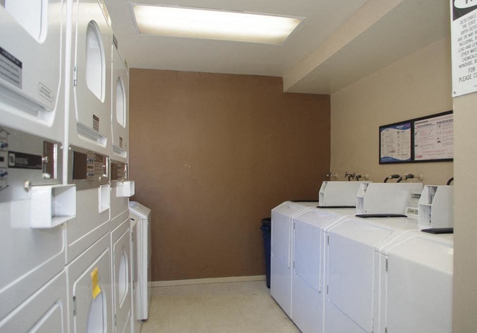Apartments in Downtown Walnut Creek, CA - Community Laundry Room with Multiple Front Load Machines