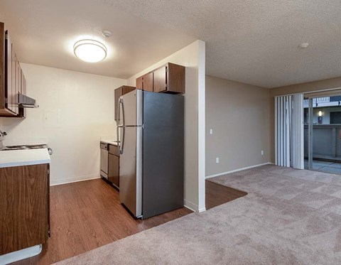 Kitchen with view of living room l Park Club Apts