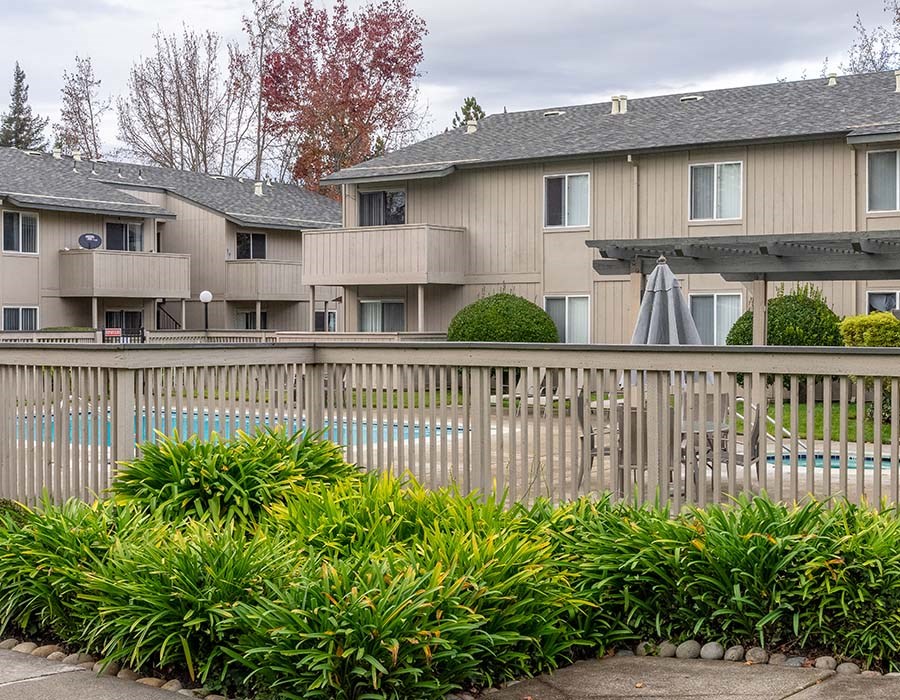 View of pool and buildings l Park Club Apts