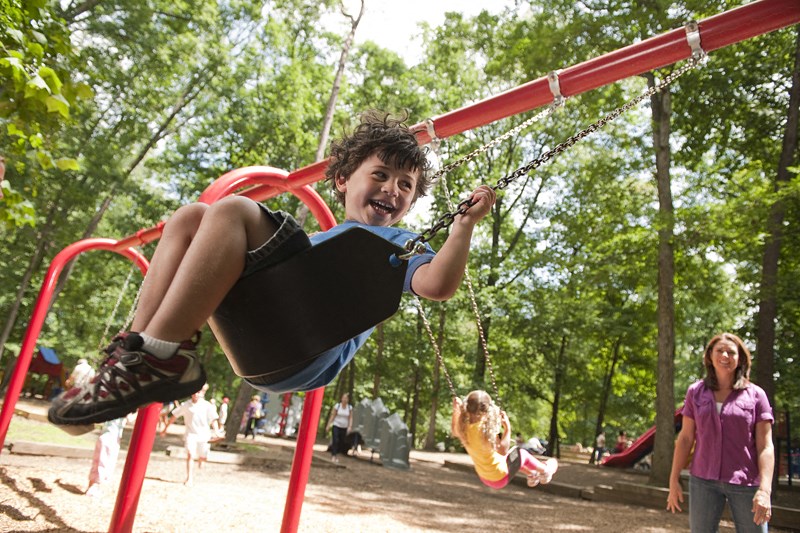 Kid on Swing | Forest Park Apartments in Chico, CA