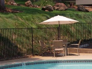 pool and lounge chairs l Apartments in Cameron Park l Cameron Ridge