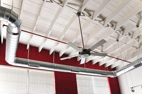 a ceiling fan hanging from the ceiling of a building