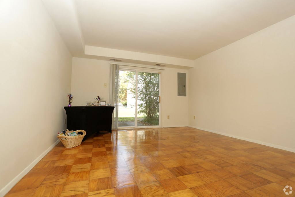 a living room with a fireplace and a sliding glass door