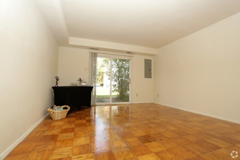 a living room with a fireplace and a sliding glass door