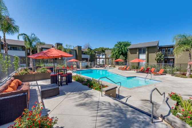 our apartments have a pool and lounge areas with umbrellas