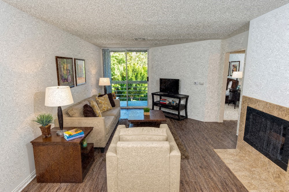 a living room with a couch and a fireplace