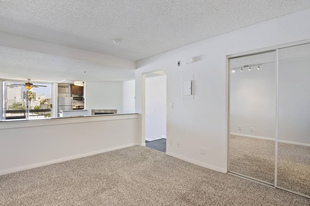 a living room with a counter and a mirror