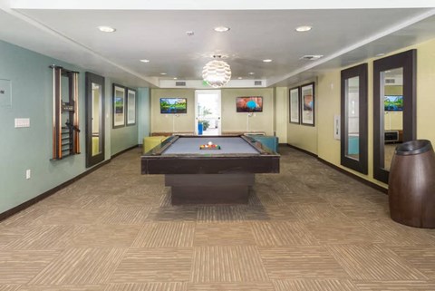 a pool table in the middle of a room