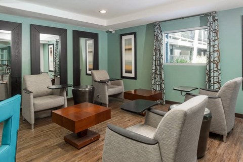 a living room with couches chairs and tables