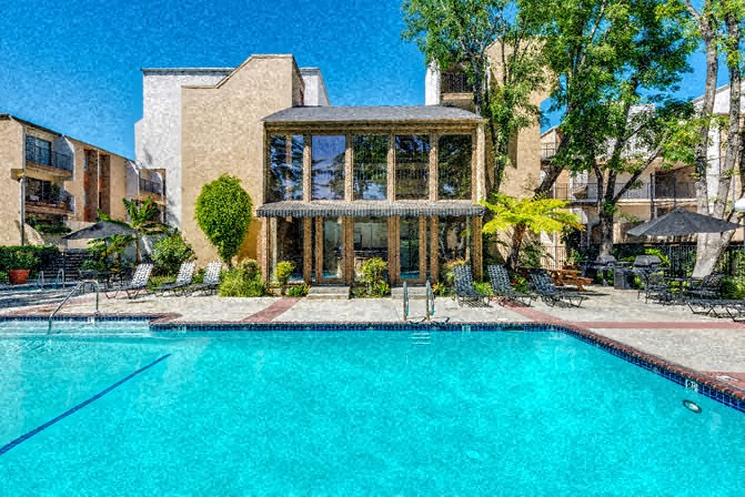 the pool is in front of a house with a swimming pool