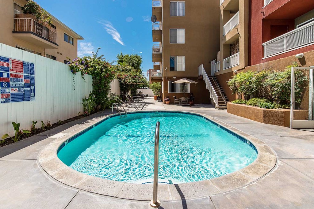 a swimming pool in the middle of an apartment building