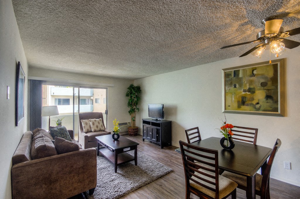 a living room and dining room with a couch and a table