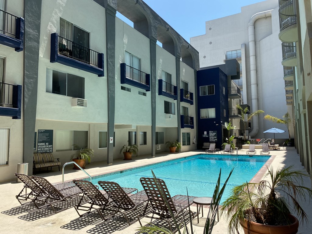 a swimming pool in front of a building
