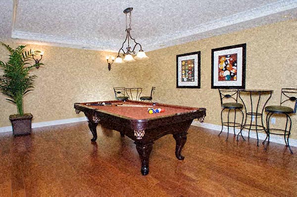 a living room with a pool table