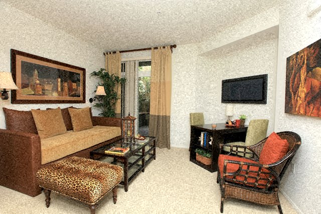 a living room with a couch and a chair