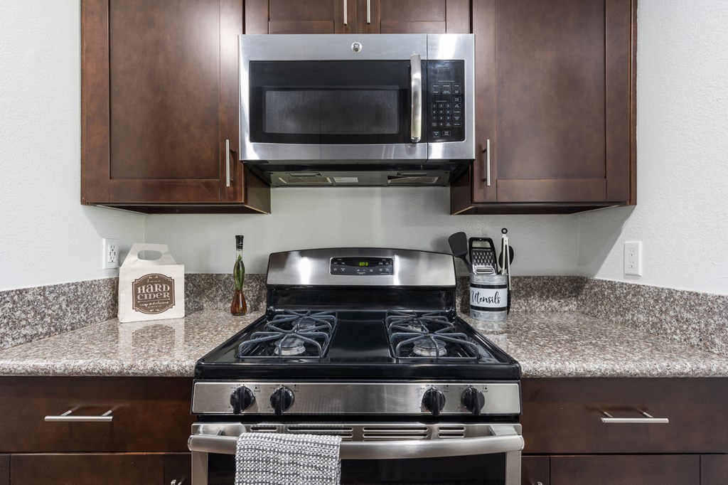our apartments have a kitchen with a stove and a microwave