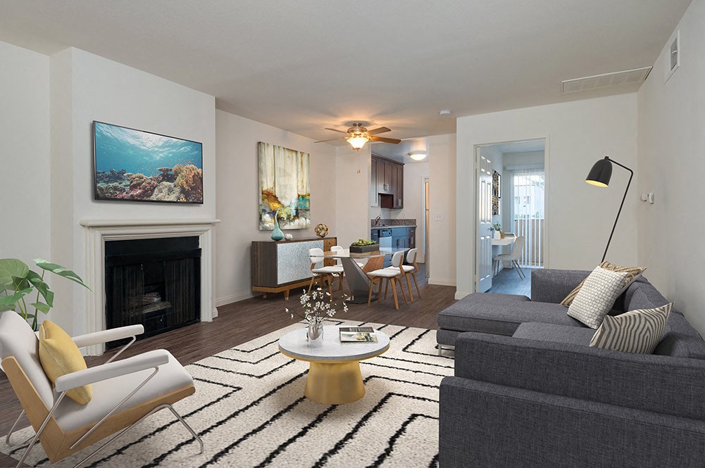 a living room with a couch and a fireplace