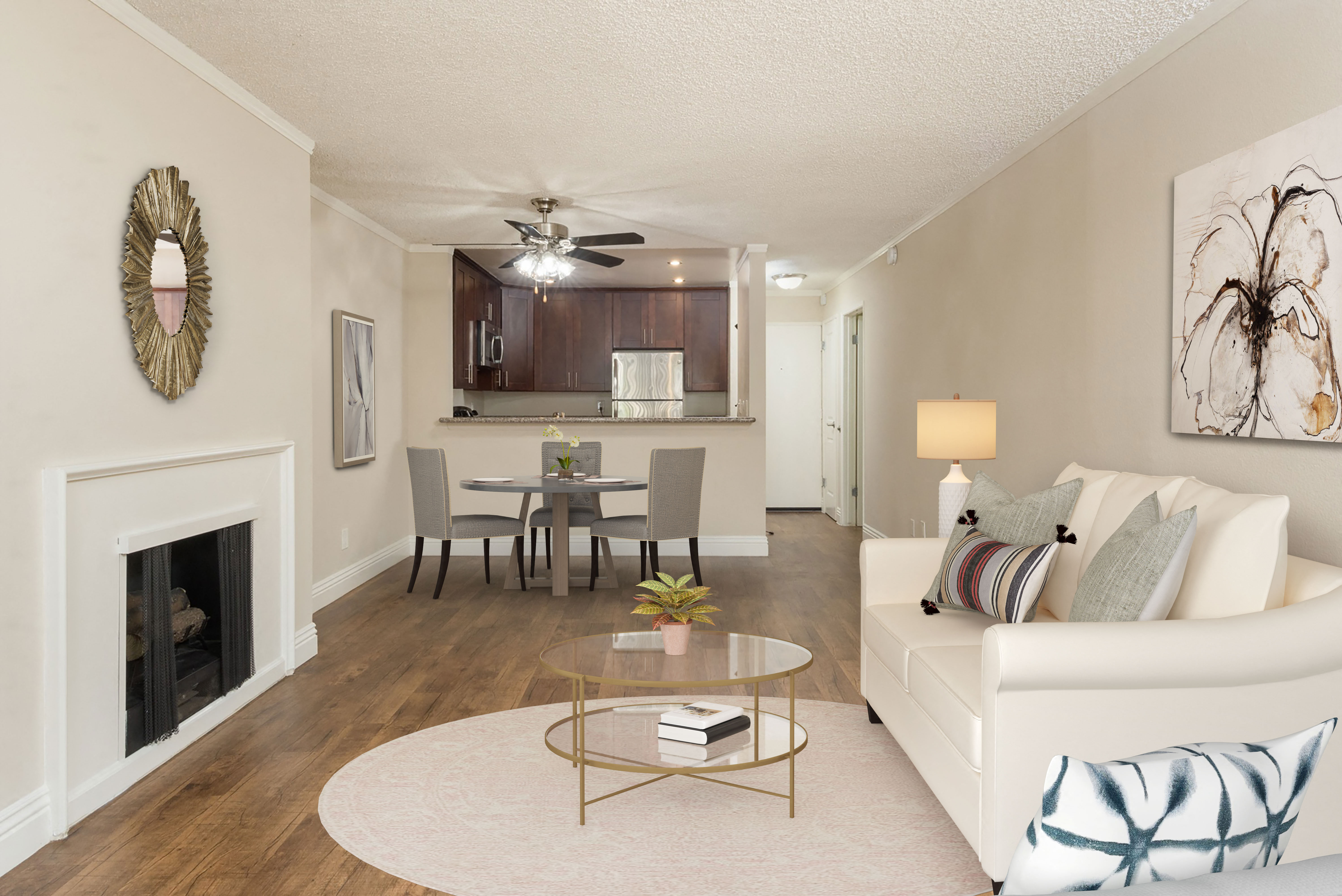 a living room with a fireplace and a table with chairs