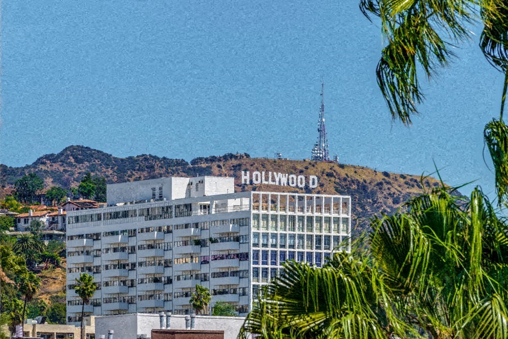 a tall building with a hollywood sign on top of it