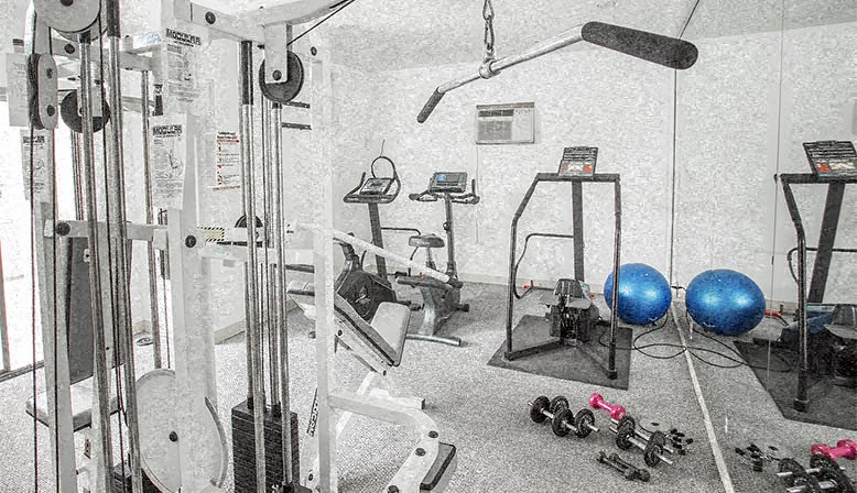 a gym with a lot of equipment in it