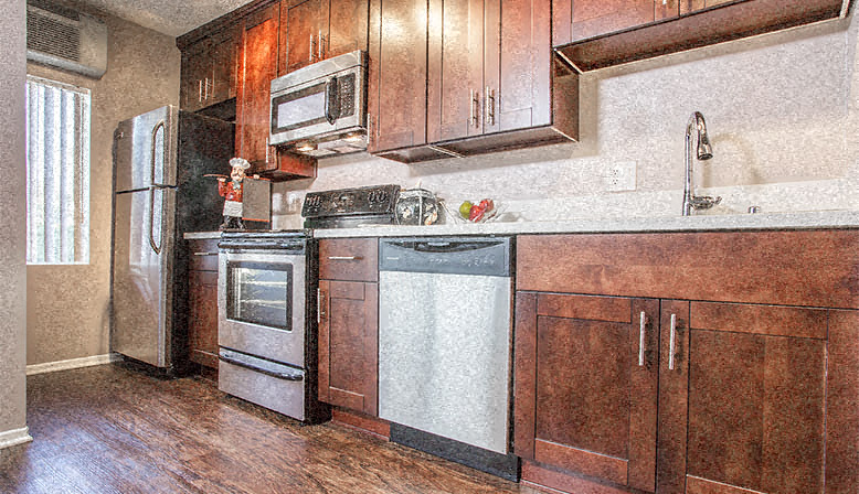a kitchen with a stove sink and refrigerator