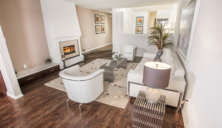 a living room with a couch and a fireplace