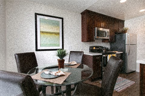 a kitchen and dining room with a table and chairs