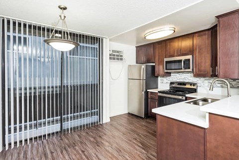 a kitchen with a sink and a refrigerator