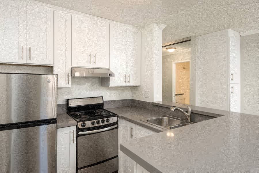 a kitchen with a stove and a sink