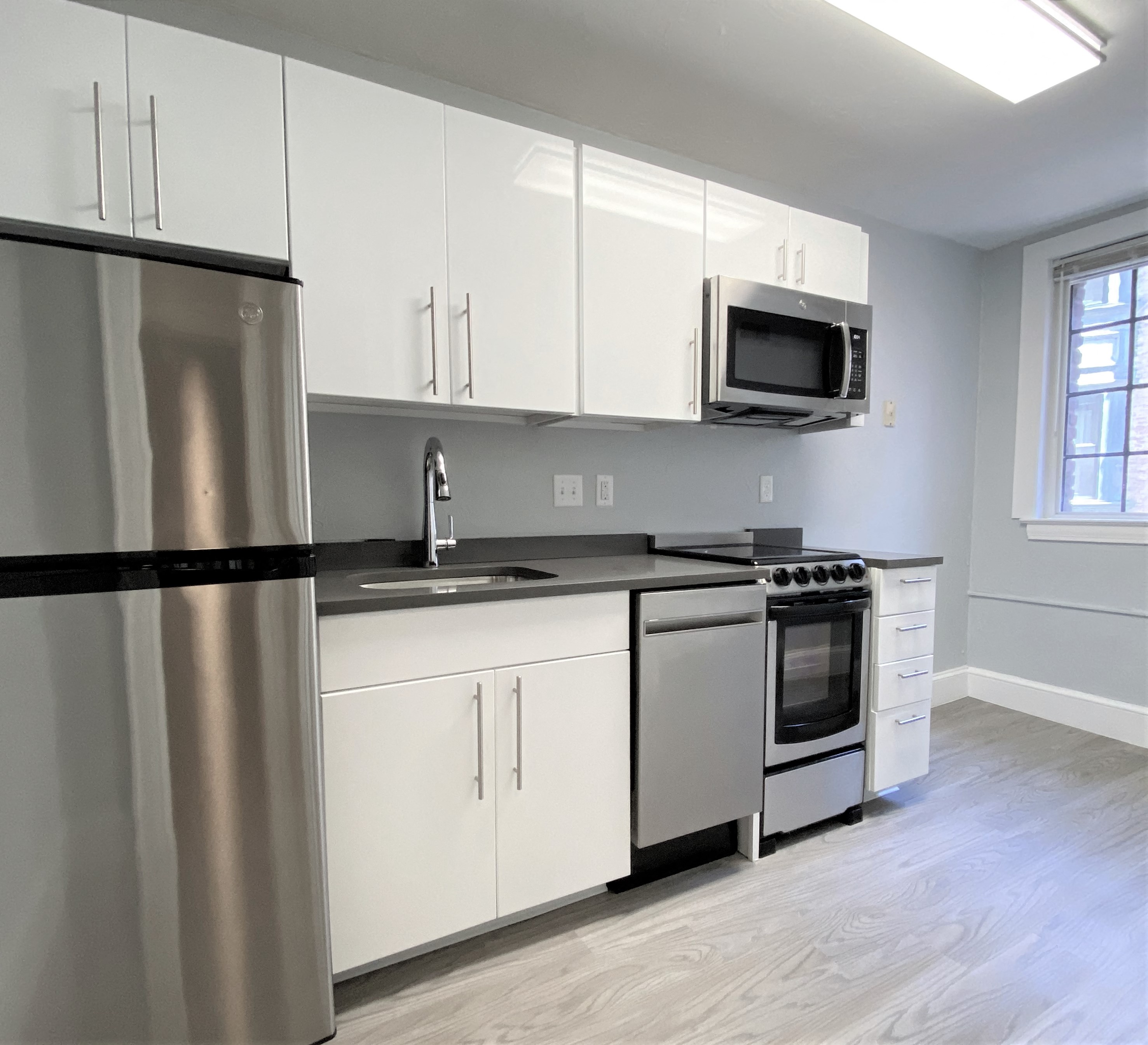 Granite counter tops, stainless steel appliances, hardwood flooring