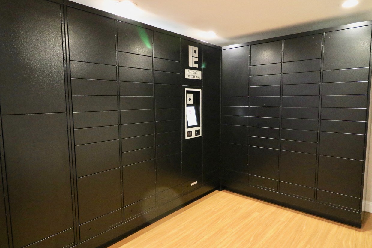 the elevators in the lobby of the building are black