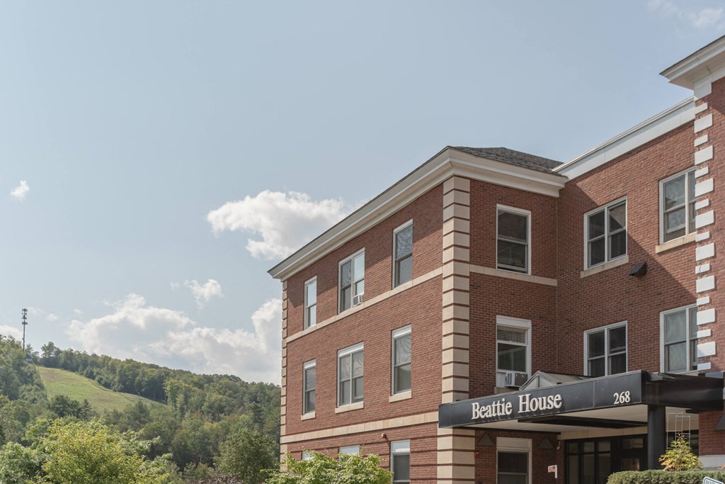 a large brick building with a sign that reads