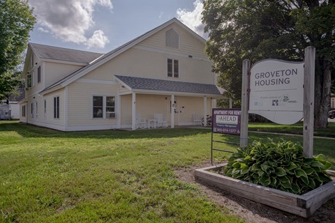a white house with a sign