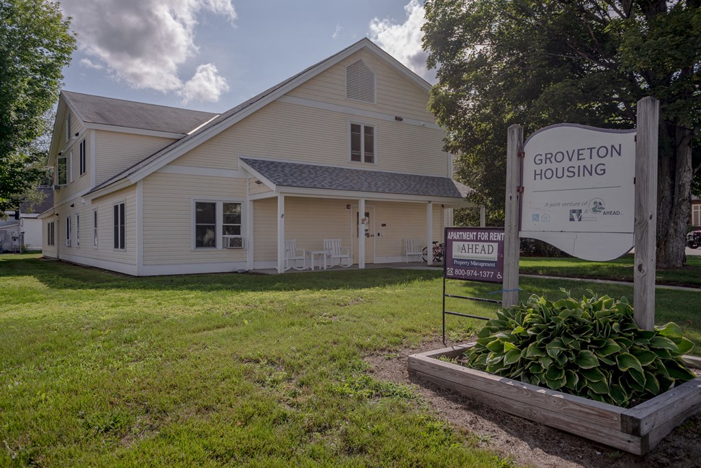 a white house with a sign