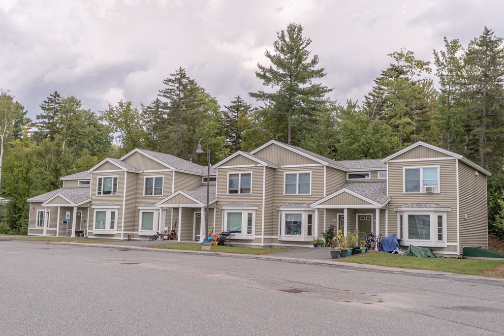 a row of houses on the side of a road